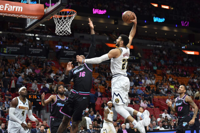Denver Nuggets guard Jamal Murray (27) dunks the ball against Miami Heat forward James Johnson (16) at American Airlines Arena.