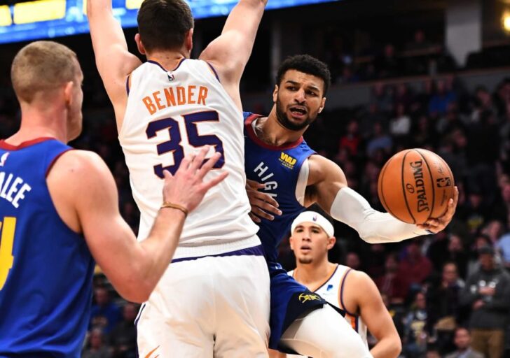 Denver Nuggets guard Jamal Murray (27) attempts a pass behind Phoenix Suns forward Dragan Bender (35) in the second quarter at the Pepsi Center.