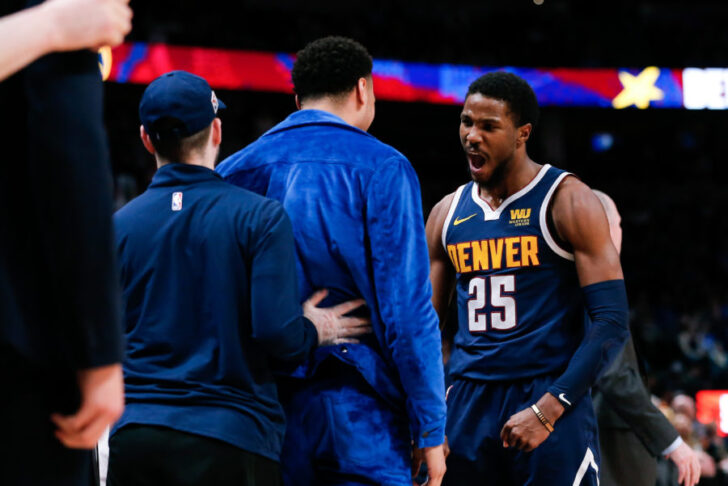 Denver Nuggets guard Malik Beasley (25) reacts with guard Jamal Murray (left) after a play in the fourth quarter against the Philadelphia 76ers at the Pepsi Center.