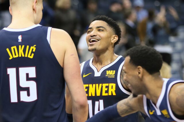 Nuggets celebrate near the end of the game. Credit: Nelson Chenault, USA TODAY Sports.