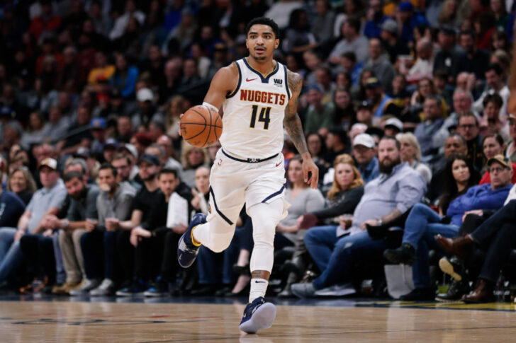 Denver Nuggets guard Gary Harris (14) dribbles the ball up court in the second quarter against the New York Knicks at the Pepsi Center.