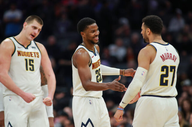 Denver Nuggets guard Jamal Murray (27) celebrates with guard Malik Beasley (25) and center Nikola Jokic (15) during the fourth quarter against the Sacramento Kings at Golden 1 Center.