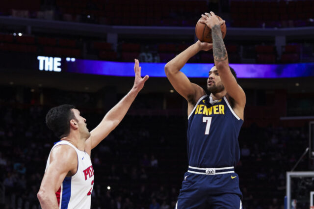 Denver Nuggets forward Trey Lyles (7) shoots over Detroit Pistons center Zaza Pachulia (27) in the first half at Little Caesars Arena.