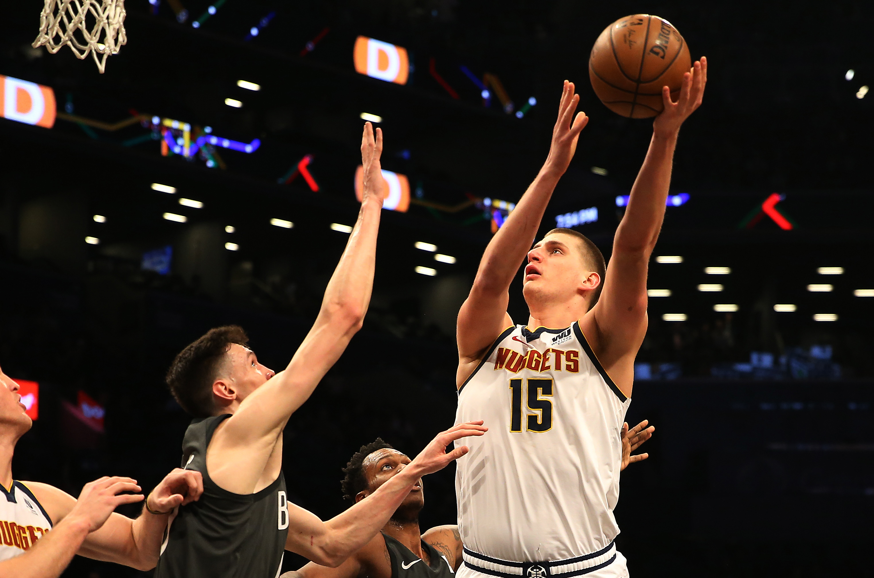 NBA: Denver Nuggets at Brooklyn Nets Denver Nuggets center Nikola Jokic (15) shoots against Brooklyn Nets forward Rodions Kurucs (00) during the first half at Barclays Center.