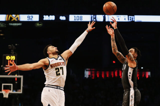 Brooklyn, NY, USA; Brooklyn Nets guard D'Angelo Russell (1) shoots against Denver Nuggets guard Jamal Murray (27) during the second half at Barclays Center.