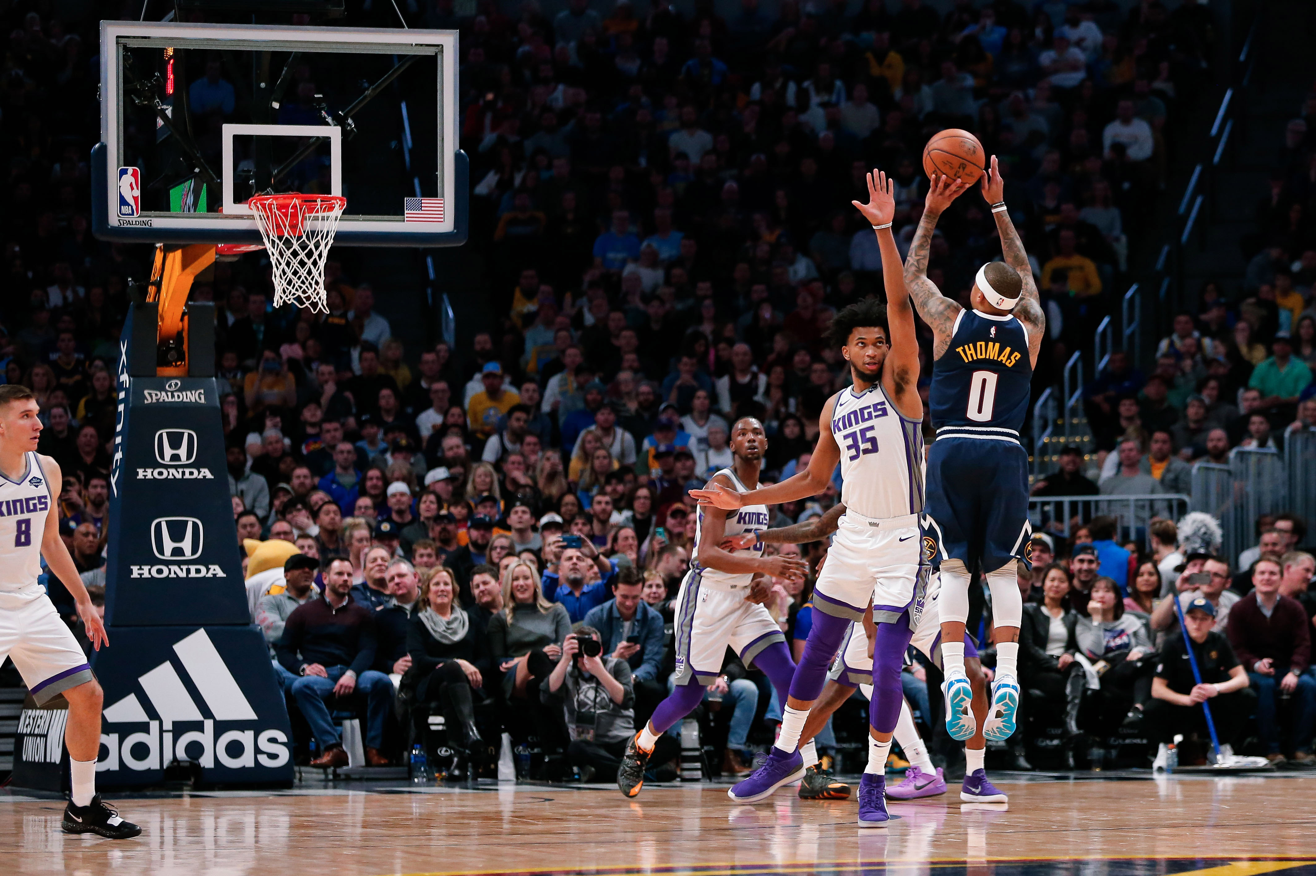 NBA: Sacramento Kings at Denver Nuggets Denver, CO, USA; Sacramento Kings forward Marvin Bagley III (35) defends on a shot from Denver Nuggets guard Isaiah Thomas (0) in the third quarter at the Pepsi Center.