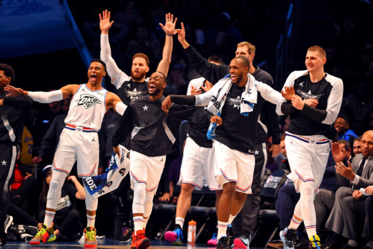 Team Giannis guard Russell Westbrook of the Oklahoma City Thunder (0), Team Giannis guard Kemba Walker of the Charlotte Hornets (15), Team Giannis forward Khris Middleton of the Milwaukee Bucks (22) and Team Giannis center Nikola Jokic of the Denver Nuggets (15) react on the bench during the 2019 NBA All-Star Game at Spectrum Center