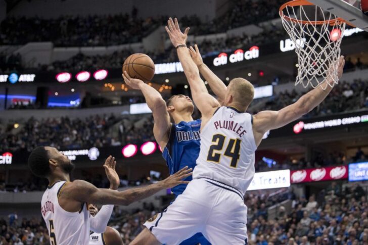 Denver Nuggets guard Will Barton (5) and forward Mason Plumlee (24) defend against Dallas Mavericks forward Dwight Powell (7) during second quarter at the American Airlines Center.