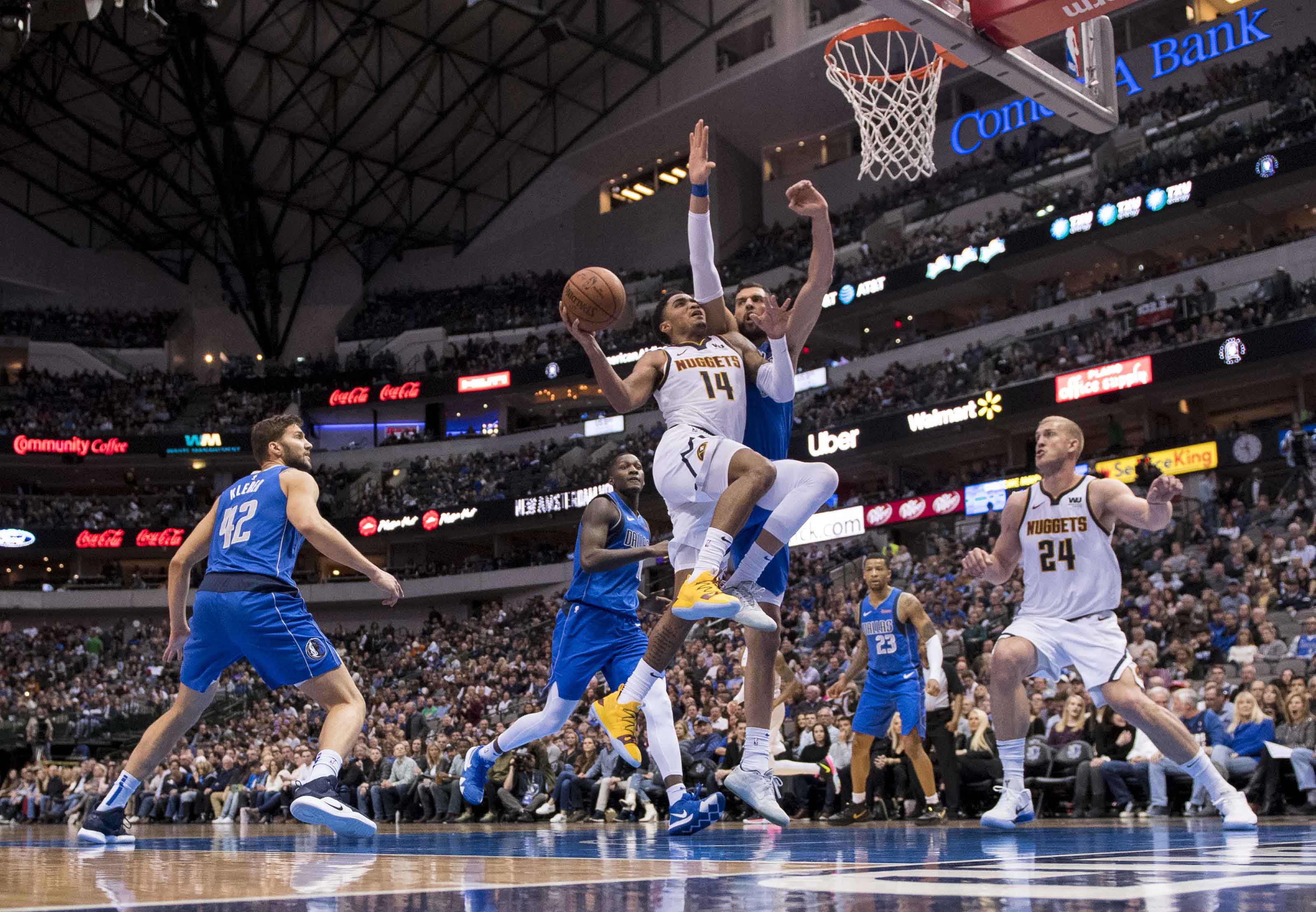 NBA: Denver Nuggets at Dallas Mavericks Denver Nuggets guard Gary Harris (14) drives to the basket past Dallas Mavericks forward Maximilian Kleber (42) and forward Dwight Powell (7) and forward Dorian Finney-Smith (10) during second half at the American Airlines Center.