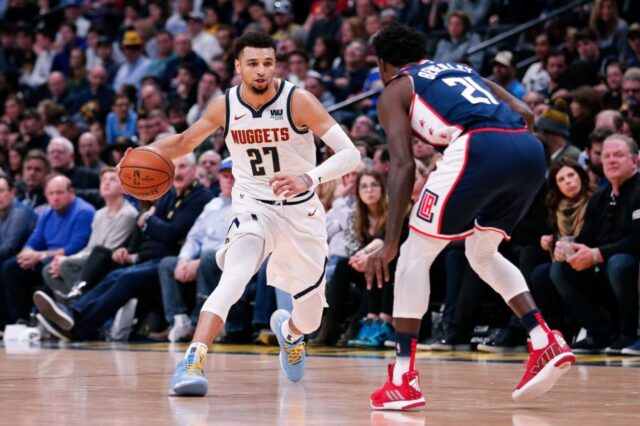Los Angeles Clippers guard Patrick Beverley (21) guards Denver Nuggets guard Jamal Murray (27) in the second quarter at the Pepsi Center.