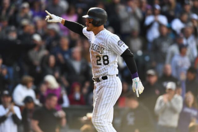 Colorado Rockies third baseman Nolan Arenado (28) celebrates his second home run of the game a solo home run in the seventh inning against the Washington Nationals at Coors Field.