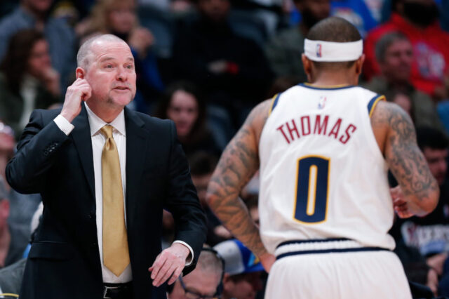 Denver Nuggets head coach Michael Malone talks with guard Isaiah Thomas (0) in the fourth quarter against the Los Angeles Clippers at the Pepsi Center.