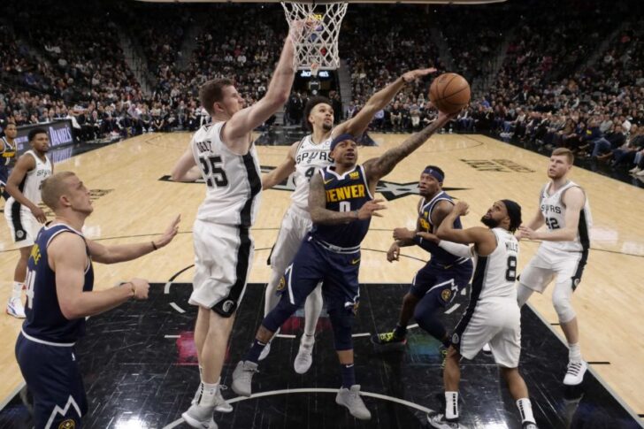 Denver Nuggets point guard Isaiah Thomas (0) has his shot blocked by San Antonio Spurs point guard Derrick White (4) during the second half at AT&T Center.