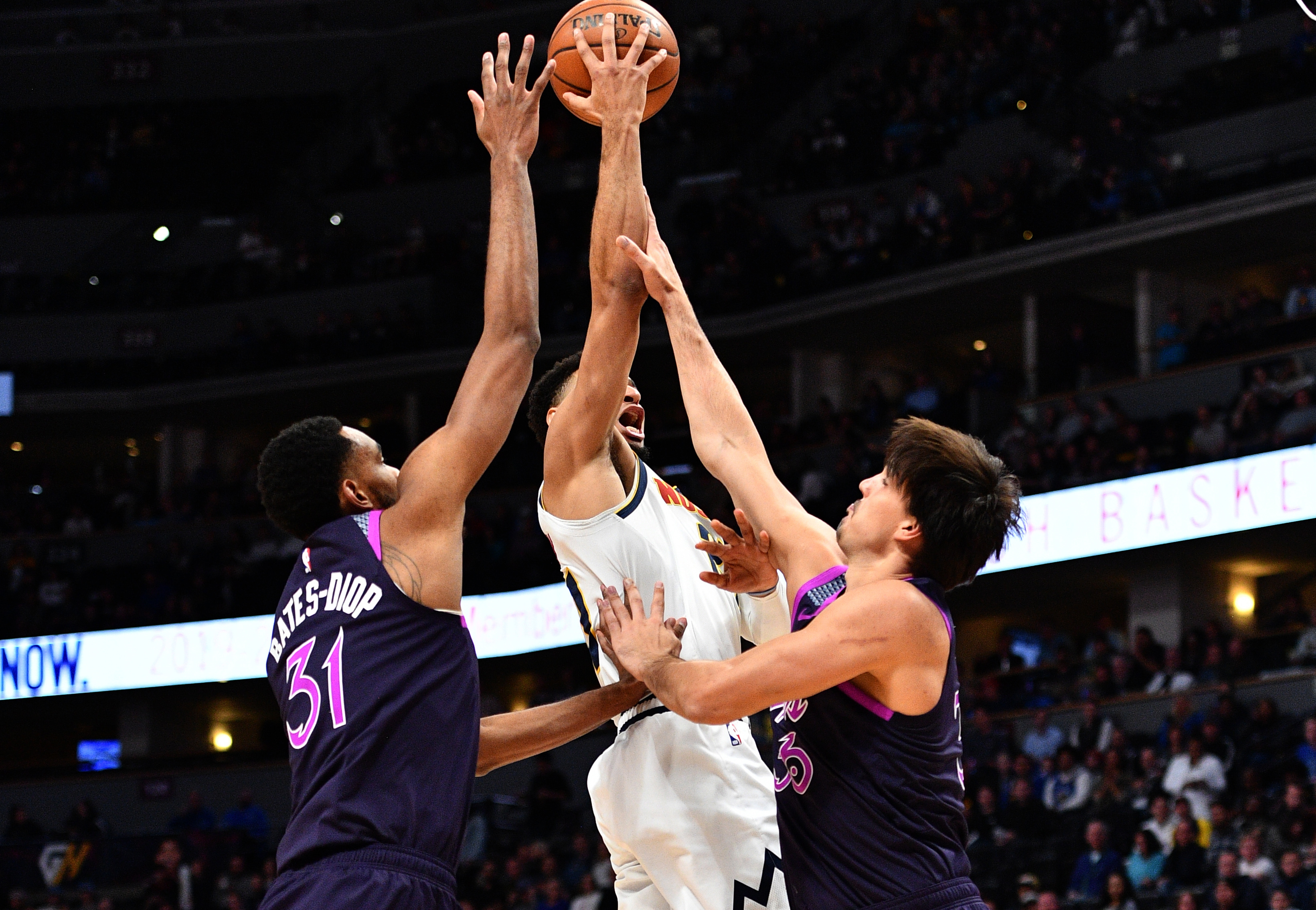 NBA: Minnesota Timberwolves at Denver Nuggets Minnesota Timberwolves forward Keita Bates-Diop (31) and forward Dario Saric (36) defend against Denver Nuggets guard Jamal Murray (27) in the first quarter at the Pepsi Center.