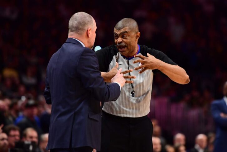 NBA referee Tony Brothers (25) talks to Denver Nuggets head coach Michael Malone following a foul called in the fourth quarter against the Indiana Pacers at the Pepsi Center.