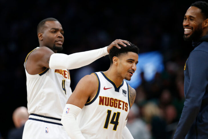 Denver Nuggets center Paul Millsap (4) and guard Gary Harris (14) celebrate during the second half against the Boston Celtics at TD Garden.