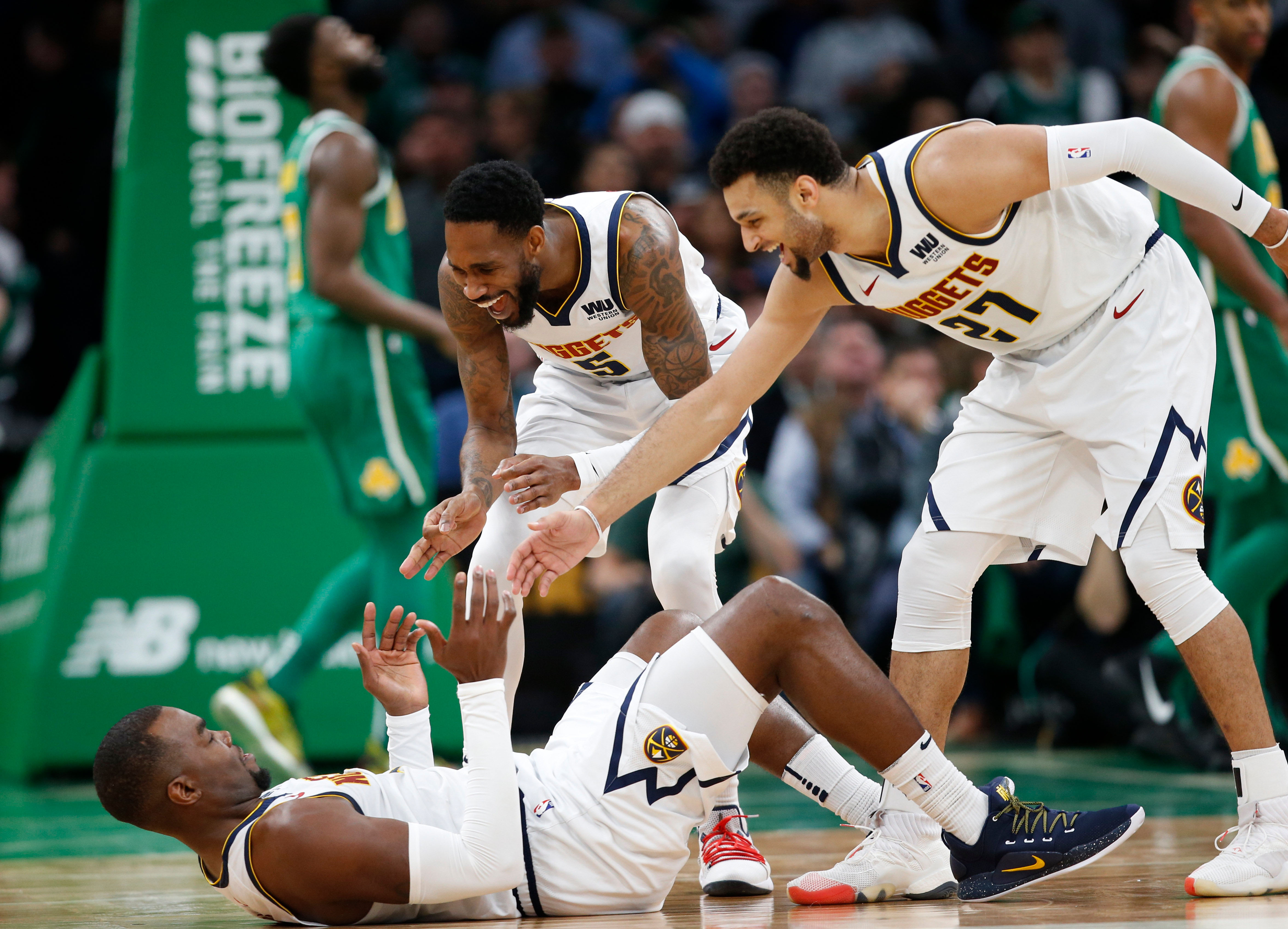 NBA: Denver Nuggets at Boston Celtics Denver Nuggets guard Will Barton (5) and guard Jamal Murray (27) celebrate with center Paul Millsap (4) during the second half against the Boston Celtics at TD Garden.
