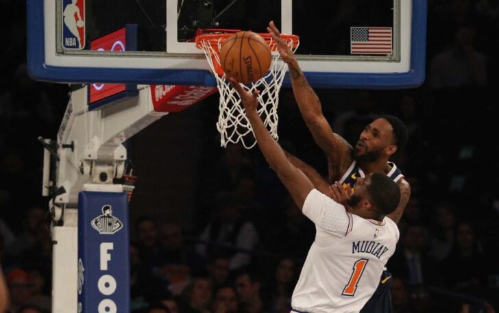 Denver Nuggets shooting guard Will Barton (5) blocks a shot by New York Knicks point guard Emmanuel Mudiay (1) during the first quarter at Madison Square Garden.
