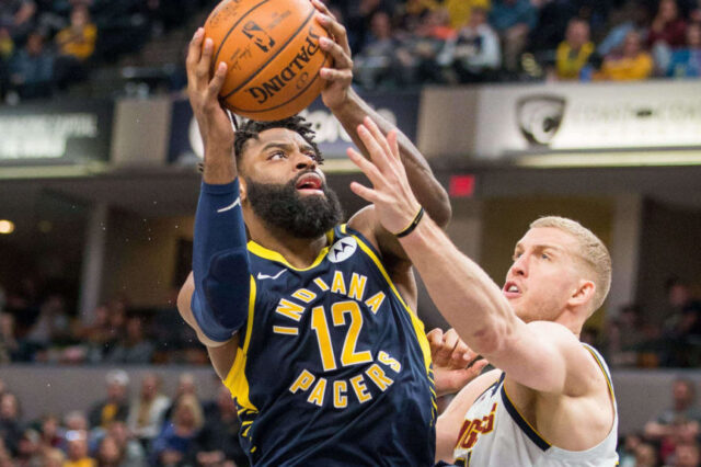 ndiana Pacers guard Tyreke Evans (12) shoots the ball while Denver Nuggets forward Mason Plumlee (24) defends in the second half at Bankers Life Fieldhouse.
