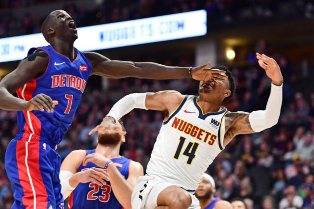 The left hand of Detroit Pistons forward Thon Maker (7) hits Denver Nuggets guard Gary Harris (14) after an attempted shot in the first quarter at the Pepsi Center.