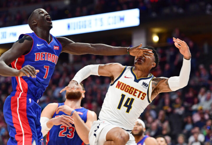 The left hand of Detroit Pistons forward Thon Maker (7) hits Denver Nuggets guard Gary Harris (14) after an attempted shot in the first quarter at the Pepsi Center.