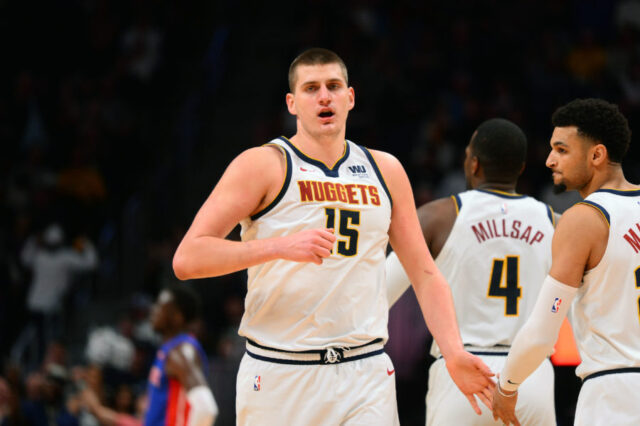 Denver Nuggets center Nikola Jokic (15) reacts after scoring in the second half against the Detroit Pistons at the Pepsi Center.