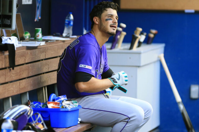 Colorado Rockies third baseman Nolan Arenado (28) looks on from the dugout after flying out in the fourth inning against the Miami Marlins at Marlins Park.