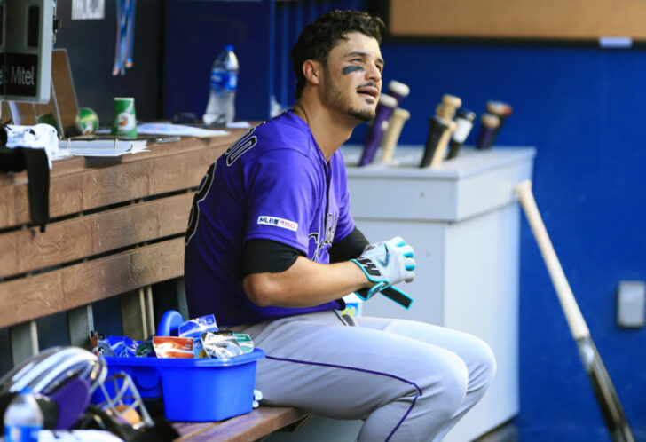 Colorado Rockies third baseman Nolan Arenado (28) looks on from the dugout after flying out in the fourth inning against the Miami Marlins at Marlins Park.