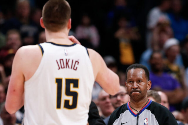 Denver Nuggets center Nikola Jokic (15) argues a call with referee James Capers (19) and is ejected on a double technical foul in the fourth quarter against the Washington Wizards at the Pepsi Center.