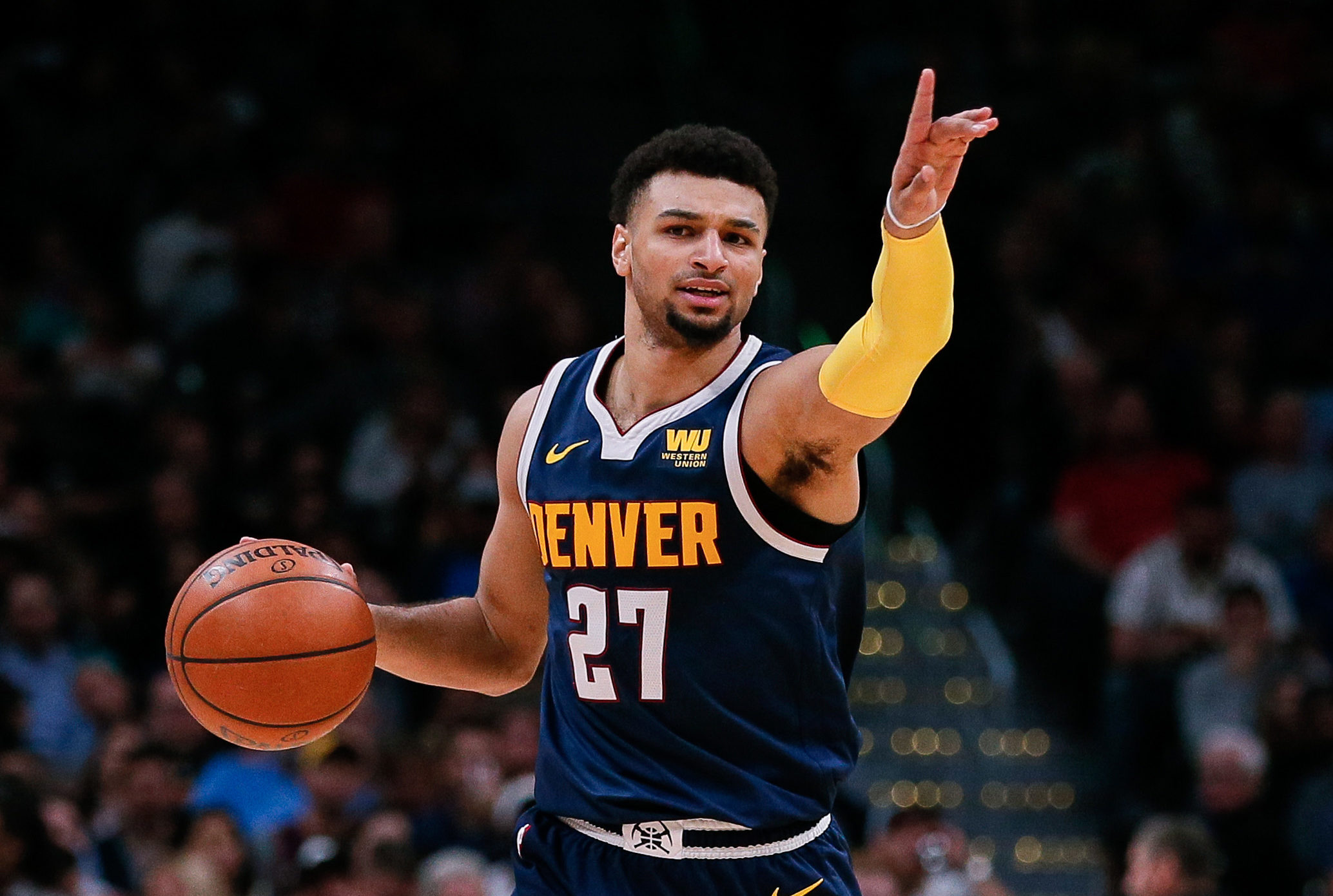 NBA: San Antonio Spurs at Denver Nuggets Denver Nuggets guard Jamal Murray (27) motions as he dribbles the ball up court in the second quarter against the San Antonio Spurs at the Pepsi Center.