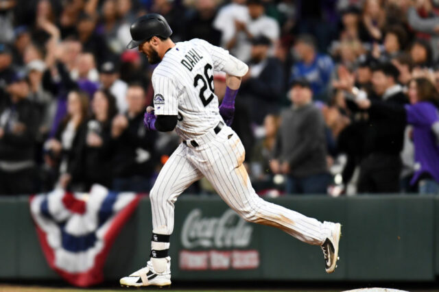 Colorado Rockies left fielder David Dahl (26) runs the bases after hitting a solo home run in the fourth inning against the Los Angeles Dodgers at Coors Field.