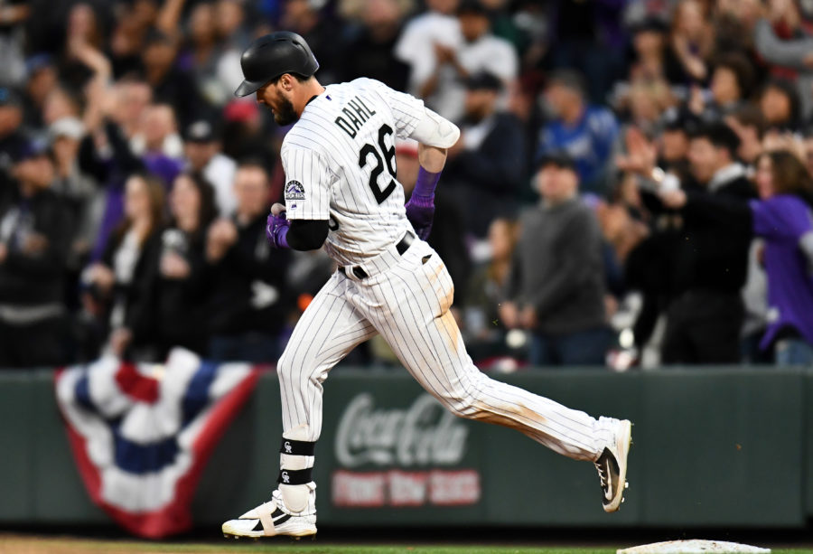 Colorado Rockies left fielder David Dahl (26) runs the bases after hitting a solo home run in the fourth inning against the Los Angeles Dodgers at Coors Field.