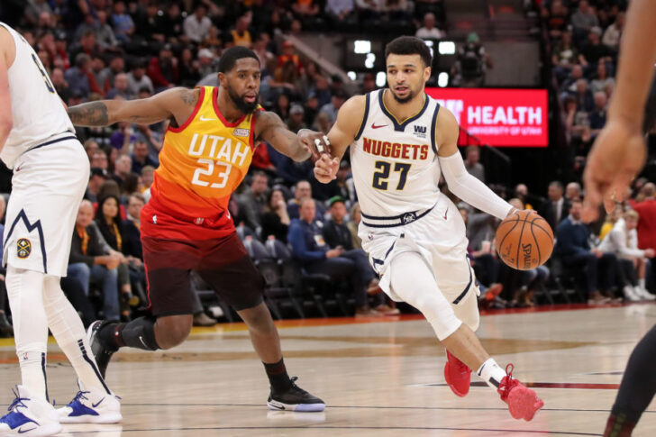 Denver Nuggets guard Jamal Murray (27) dribbles the ball around Utah Jazz forward Royce O'Neale (23) during the first quarter at Vivint Smart Home Arena.