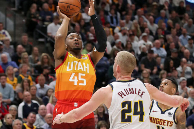 Utah Jazz guard Donovan Mitchell (45) shoots the ball over Denver Nuggets forward Mason Plumlee (24) during the fourth quarter at Vivint Smart Home Arena. Utah Jazz won 118-108.
