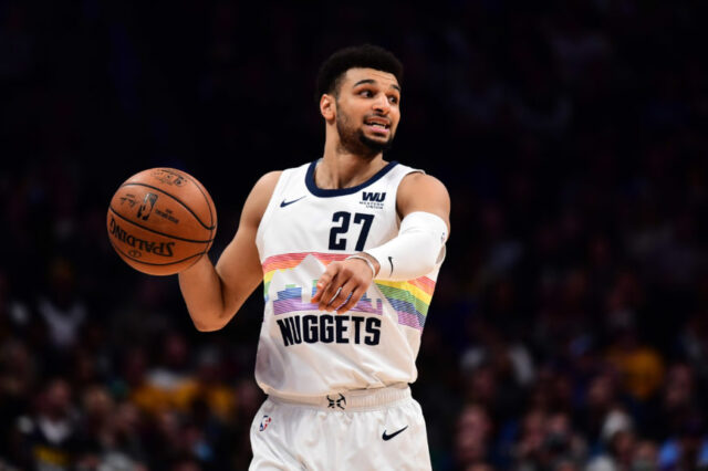 Denver Nuggets guard Jamal Murray (27) provides direction in the second quarter against the Minnesota Timberwolves at the Pepsi Center.