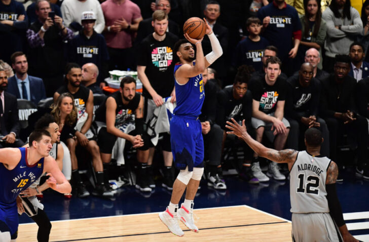 Denver Nuggets guard Jamal Murray (27) shoots over San Antonio Spurs center LaMarcus Aldridge (12) in the second half in the first round of the 2019 NBA Playoffs at Pepsi Center.