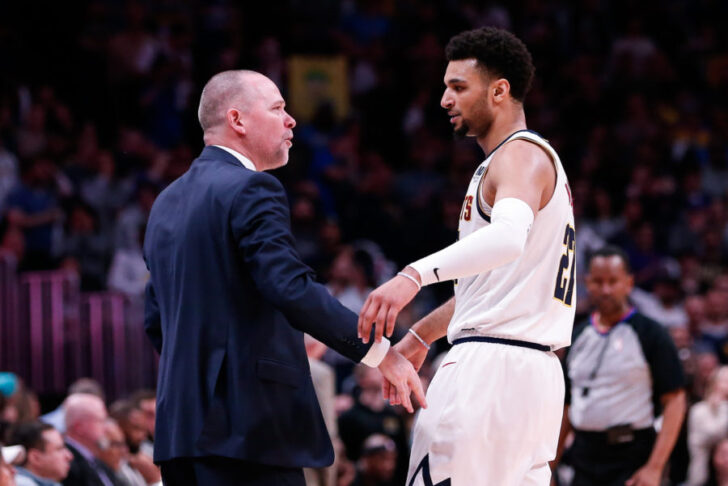 Denver Nuggets head coach Michael Malone reacts with guard Jamal Murray (27) in the fourth quarter against the San Antonio Spurs in game two of the first round of the 2019 NBA Playoffs at the Pepsi Center.