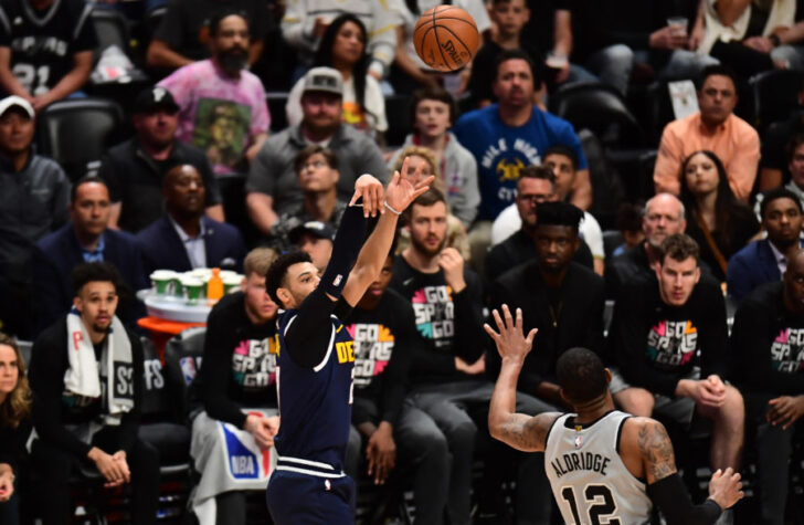 Denver Nuggets guard Jamal Murray (27) shoots over San Antonio Spurs center LaMarcus Aldridge (12) in the fourth quarter in game seven of the first round of the 2019 NBA Playoffs at the Pepsi Center.
