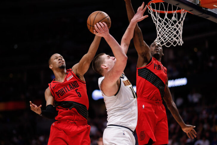 ortland Trail Blazers guard Rodney Hood (5) blocks the shot of Denver Nuggets center Nikola Jokic (15) as forward Al-Farouq Aminu (8) defends in the third quarter in game two of the second round of the 2019 NBA Playoffs at the Pepsi Center.