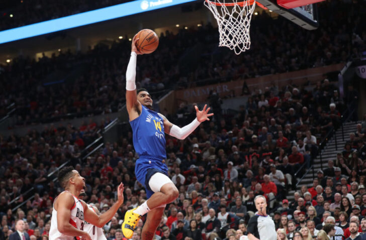 Denver Nuggets guard Gary Harris (14) dunks over Portland Trail Blazers in the first half of game three of the second round of the 2019 NBA Playoffs at Moda Center.