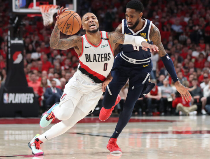 Portland Trail Blazers guard Damian Lillard (0) drives against Denver Nuggets guard Will Barton (5) in the second half of game four of the second round of the 2019 NBA Playoffs at Moda Center.