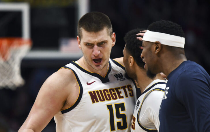 Denver Nuggets center Nikola Jokic (15) reacts following a score with guard Jamal Murray (27) and forward Torrey Craig (3) in the second quarter against the Portland Trail Blazers in game five of the second round of the 2019 NBA Playoffs at Pepsi Center.