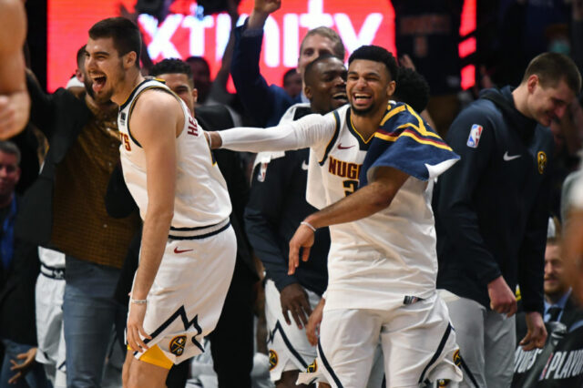 Denver Nuggets forward Juan Hernangomez (41) reacts to his successful three-point basket with guard Jamal Murray (27) in the fourth quarter against the Portland Trail Blazers in game five of the second round of the 2019 NBA Playoffs at Pepsi Center.
