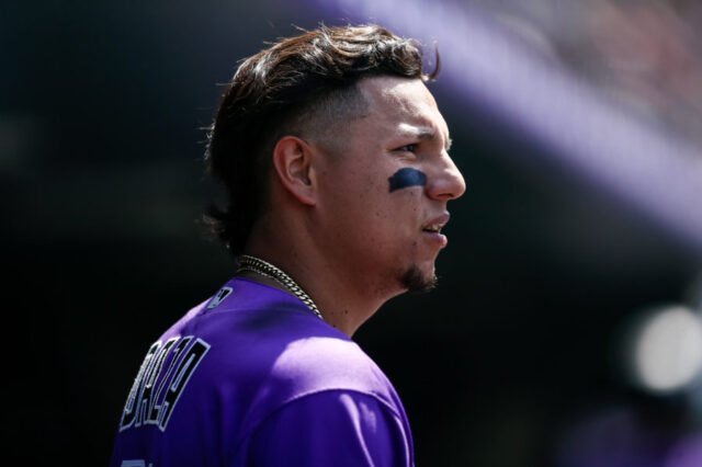 Colorado Rockies center fielder Yonathan Daza (31) looks on from the dugout in the fifth inning against the Arizona Diamondbacks at Coors Field.