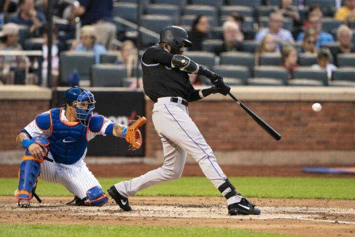 Colorado Rockies right fielder Charlie Blackmon (19) hits an rbi single] during the third inning against the New York Mets at Citi Field.