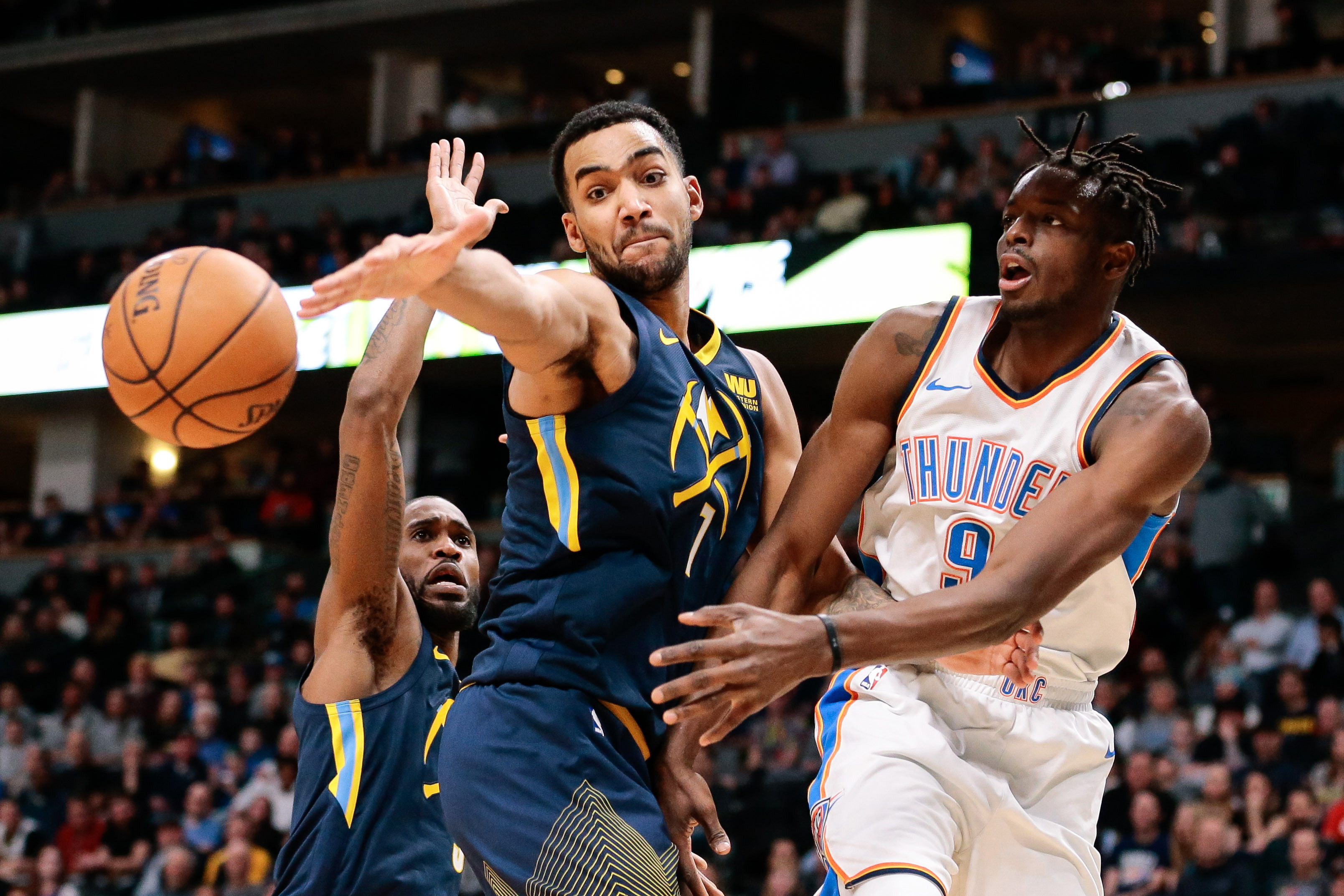 Denver Nuggets forward Trey Lyles (7) and guard Will Barton (5) defend against Oklahoma City Thunder forward Jerami Grant (9) in the fourth quarter at the Pepsi Center.