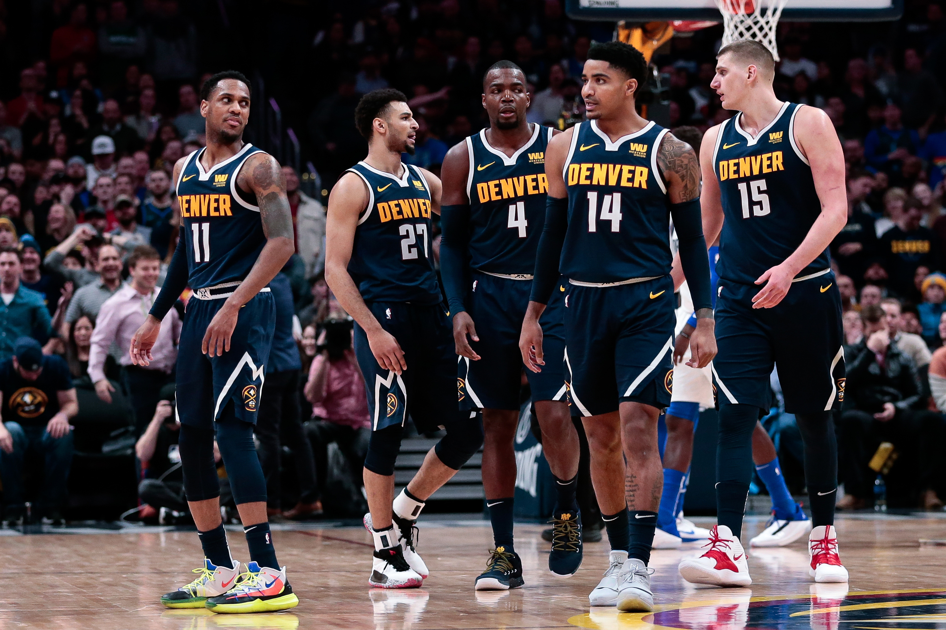 Denver Nuggets guard Monte Morris (11) and guard Jamal Murray (27) and forward Paul Millsap (4) and guard Gary Harris (14) and center Nikola Jokic (15) in the fourth quarter against the Dallas Mavericks at the Pepsi Center.