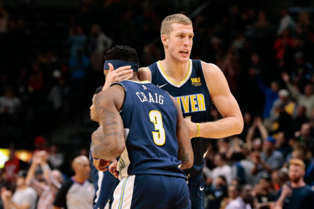 Denver Nuggets center Mason Plumlee (24) celebrates with guard Torrey Craig (3) after the game against the New Orleans Pelicans at the Pepsi Center.