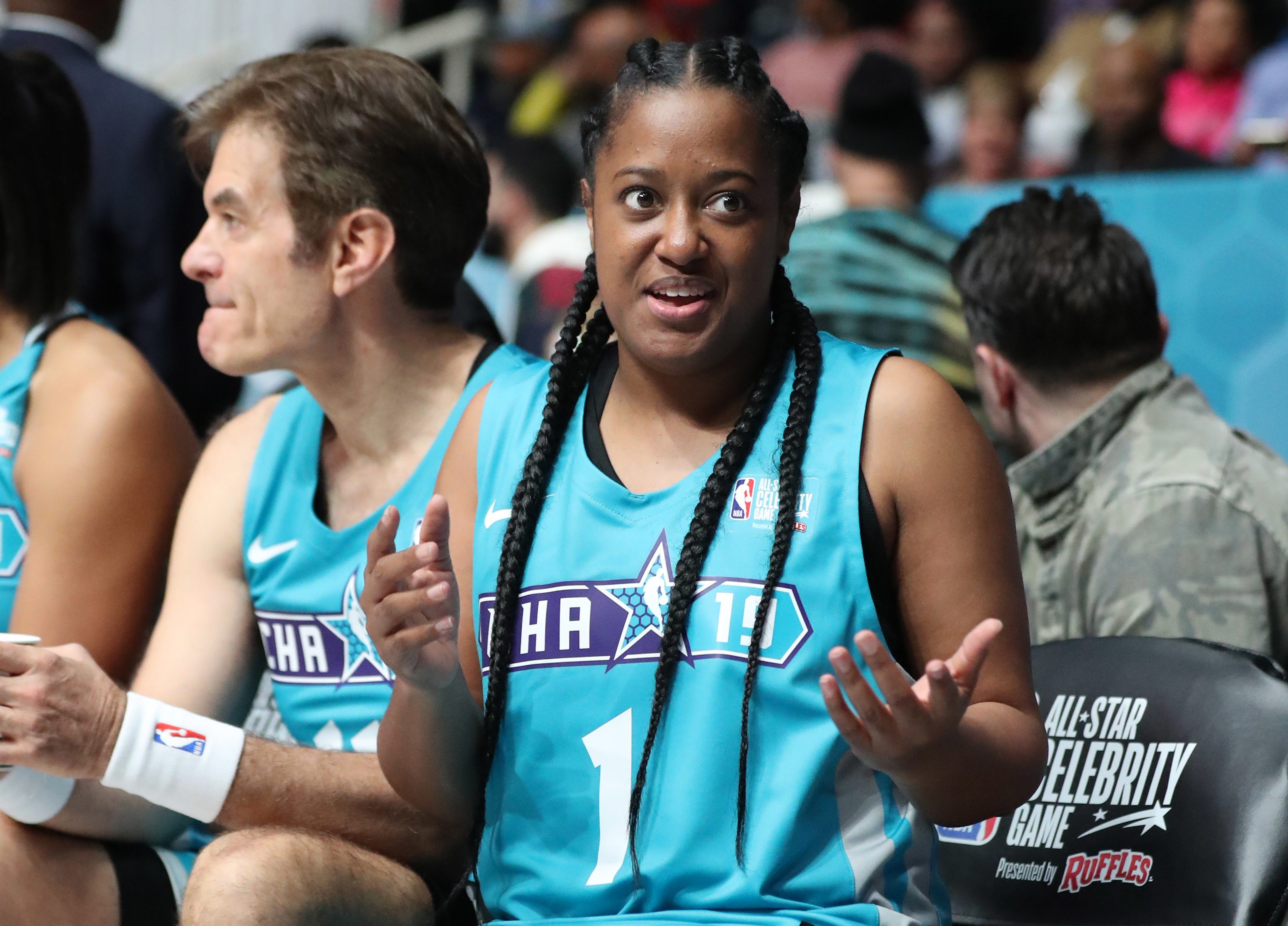 NBA: All-Star Celebrity Game Home Team player Rapsody reacts on the bench during the third quarter against the Away Team at Bojangles Coliseum .