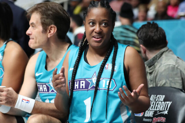 Home Team player Rapsody reacts on the bench during the third quarter against the Away Team at Bojangles Coliseum .